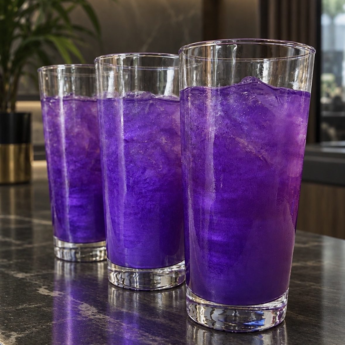 Blossom Bliss mocktail: three glasses of a vivid purple sparkler