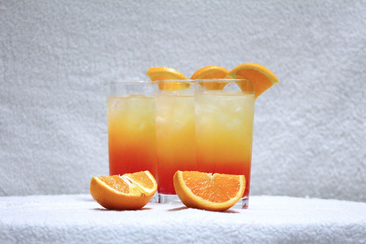 Golden Hour mocktail: a layered sunset citrus cooler with orange slices