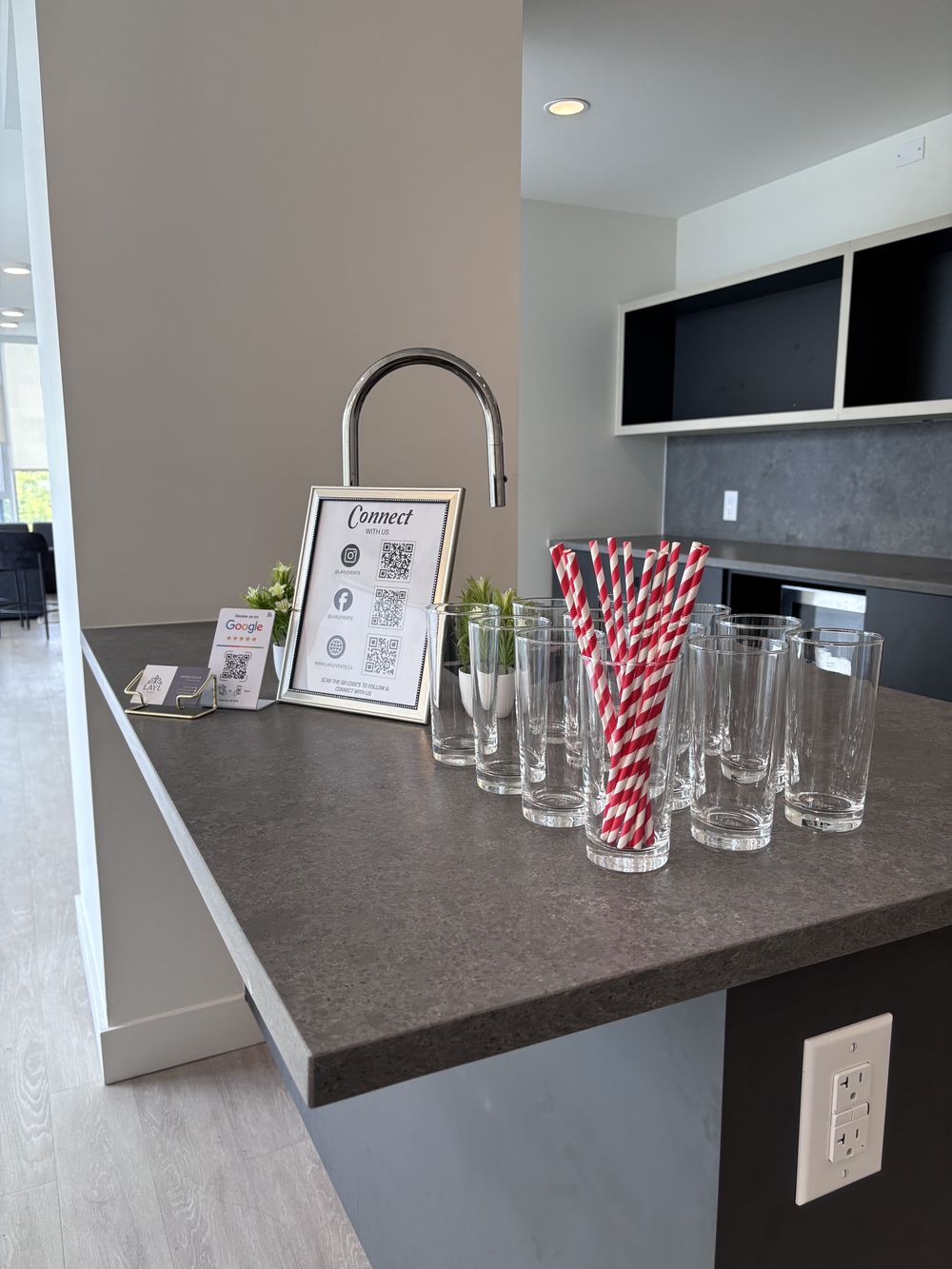 Glassware and striped straws set out before an event